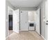 Laundry room with washer and dryer, white doors, and tile flooring at 5336 Monticello Dr, Villa Rica, GA 30180