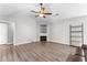 Bright living room with hardwood floors, fireplace, and view of the kitchen at 5336 Monticello Dr, Villa Rica, GA 30180