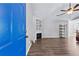 Open living room with a fireplace, stylish shelving, and hardwood flooring at 5336 Monticello Dr, Villa Rica, GA 30180