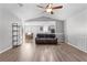 Open-concept living room featuring a ceiling fan, hardwood floors, and lots of natural light at 5336 Monticello Dr, Villa Rica, GA 30180