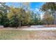 Community picnic area with tables and grills nestled among mature trees at 5336 Monticello Dr, Villa Rica, GA 30180