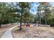A colorful community playground surrounded by mature trees and landscaping at 5336 Monticello Dr, Villa Rica, GA 30180