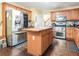 Spacious kitchen with an island, stainless steel appliances, and wood cabinetry at 625 Sycamore Glen Nw Ct, Lawrenceville, GA 30044