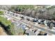 An aerial view of a quiet neighborhood showcases rows of well-maintained homes nestled among mature trees at 903 Creek Bottom Rd, Loganville, GA 30052