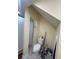 Bathroom featuring toilet, shower with curtain, neutral wall color, and tile flooring at 903 Creek Bottom Rd, Loganville, GA 30052
