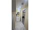 Bathroom featuring vanity, round mirror, under cabinet storage, and modern lighting fixture at 903 Creek Bottom Rd, Loganville, GA 30052
