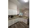 Well-lit kitchen boasts granite counters, stainless steel sink, and ample counter space at 903 Creek Bottom Rd, Loganville, GA 30052