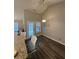 Cozy kitchen nook with granite counters, wood floors, and a view to the backyard at 903 Creek Bottom Rd, Loganville, GA 30052