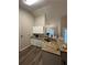 Bright kitchen featuring granite counters, a stainless steel sink and tile backsplash at 903 Creek Bottom Rd, Loganville, GA 30052