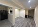 Open-concept living room featuring wood-look floors and neutral paint colors throughout at 903 Creek Bottom Rd, Loganville, GA 30052
