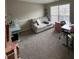 Cozy home office with plush carpeting and a comfortable sofa, perfect for remote work or study at 903 Creek Bottom Rd, Loganville, GA 30052