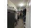 Walk-in closet offering ample shelving and hanging storage for clothing and accessories at 903 Creek Bottom Rd, Loganville, GA 30052