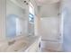 Bathroom featuring a double sink vanity, tub, and shower with natural light at 1126 Indale Sw Pl, Atlanta, GA 30310