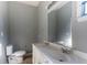 Bathroom featuring a double sink vanity, toilet, and large mirror at 1126 Indale Sw Pl, Atlanta, GA 30310