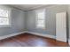Bedroom with hardwood floors, natural light, and a classic interior door at 1126 Indale Sw Pl, Atlanta, GA 30310