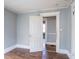 Bedroom features hardwood floors, natural light, and door to another room at 1126 Indale Sw Pl, Atlanta, GA 30310
