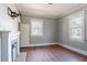 Cozy living room with hardwood floors, a decorative fireplace, and a wall-mounted TV bracket at 1126 Indale Sw Pl, Atlanta, GA 30310