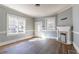 Sunlit living room with beautiful hardwood floors, a decorative fireplace, and a classic design at 1126 Indale Sw Pl, Atlanta, GA 30310