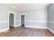 Spacious room with natural light, hardwood floors, and classic architectural details at 1126 Indale Sw Pl, Atlanta, GA 30310