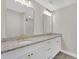 Bright bathroom with double sink vanity, granite countertops and large mirrors at 1729 Spring Ne St, Conyers, GA 30012