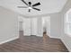 Spacious bedroom with vinyl floors, a closet, and an en suite bathroom with double sinks at 1729 Spring Ne St, Conyers, GA 30012