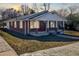 Charming brick home with a covered front porch and well-maintained landscaping at 1729 Spring Ne St, Conyers, GA 30012