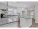 Modern kitchen with granite countertops and white cabinetry at 1729 Spring Ne St, Conyers, GA 30012