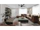 Spacious living room with a large sectional couch, modern decor, and plenty of natural light at 1729 Spring Ne St, Conyers, GA 30012