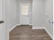 This mud room features vinyl floors and an exterior door that brings in natural light at 1729 Spring Ne St, Conyers, GA 30012