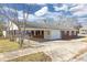 View of rear exterior with a carport and fenced yard at 1729 Spring Ne St, Conyers, GA 30012