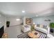 Bright basement with neutral paint, plush sofas, and large striped rug at 243 Howell Sw Ter, Atlanta, GA 30331