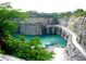 Scenic quarry lake surrounded by rock formations and green trees at 243 Howell Sw Ter, Atlanta, GA 30331