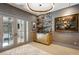 Sophisticated bar area with marble accents, display shelving, and striking artwork at 2525 Peachtree Ne Rd # 32, Atlanta, GA 30305