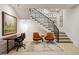 Finished basement area with a modern workspace, seating area, and staircase leading upstairs at 2525 Peachtree Ne Rd # 32, Atlanta, GA 30305