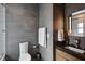 Modern bathroom featuring gray tile, modern fixtures, and a sleek vanity with a stone countertop at 2525 Peachtree Ne Rd # 32, Atlanta, GA 30305
