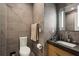 Contemporary bathroom featuring gray tile, modern fixtures, and a sleek vanity with a stone countertop at 2525 Peachtree Ne Rd # 32, Atlanta, GA 30305
