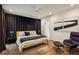 Stylish bedroom with a yellow bed, dark curtains, and modern artwork, offering a comfortable retreat at 2525 Peachtree Ne Rd # 32, Atlanta, GA 30305