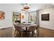 Elegant dining room with designer lighting and views into the living room at 2525 Peachtree Ne Rd # 32, Atlanta, GA 30305