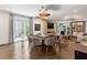 Open concept living and dining area with modern chandelier and access to outdoor living space at 2525 Peachtree Ne Rd # 32, Atlanta, GA 30305
