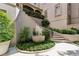 Landscaped outdoor area with a water feature and staircase leading to upper levels at 2525 Peachtree Ne Rd # 32, Atlanta, GA 30305