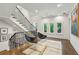 Bright landing area with modern chairs, open staircase, and ample natural light through large windows at 2525 Peachtree Ne Rd # 32, Atlanta, GA 30305