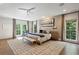 Expansive main bedroom with hardwood floors, large windows, and sitting area at 2525 Peachtree Ne Rd # 32, Atlanta, GA 30305