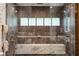 Modern shower with a rain shower head and large bench at 2525 Peachtree Ne Rd # 32, Atlanta, GA 30305