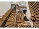 Modern staircase with wooden steps and railing showcases unique lighting feature at 2525 Peachtree Ne Rd # 32, Atlanta, GA 30305