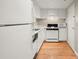 An all-white kitchen features modern appliances and lots of counter space at 1501 Clairmont Rd # 1024, Decatur, GA 30033