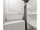 Laundry closet features a stackable washer and dryer with shelving at 1501 Clairmont Rd # 1024, Decatur, GA 30033