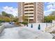 View of the building and parking lot with landscaping in blue pots at 1501 Clairmont Rd # 1024, Decatur, GA 30033