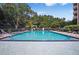 A beautiful swimming pool surrounded by mature trees, lounge chairs and seating for residents to enjoy at 1501 Clairmont Rd # 1024, Decatur, GA 30033