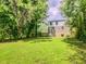 View of the backyard and the house surrounded by trees and greenery, creating a serene view at 2569 Northview Ave, Decatur, GA 30032