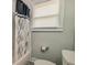 Bathroom view showcasing a white toilet, bathtub and shower at 2569 Northview Ave, Decatur, GA 30032